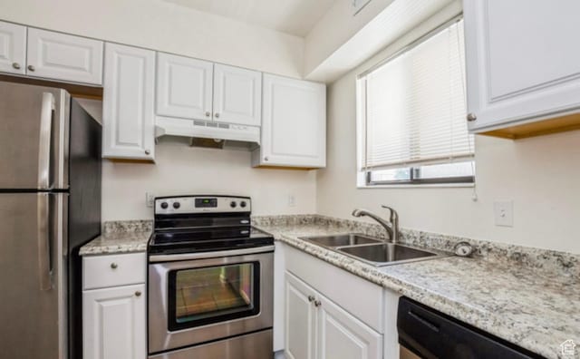 830 E 3990 S Unit D, Millcreek, UT 84107 - kitchen with a sink, white cabinetry, under cabinet range hood, and stainless steel appliances