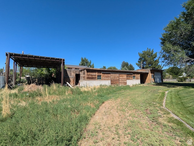 exterior space featuring an exterior structure and an outbuilding