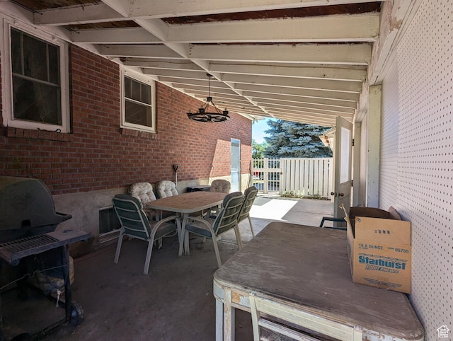 view of patio with outdoor dining space and grilling area