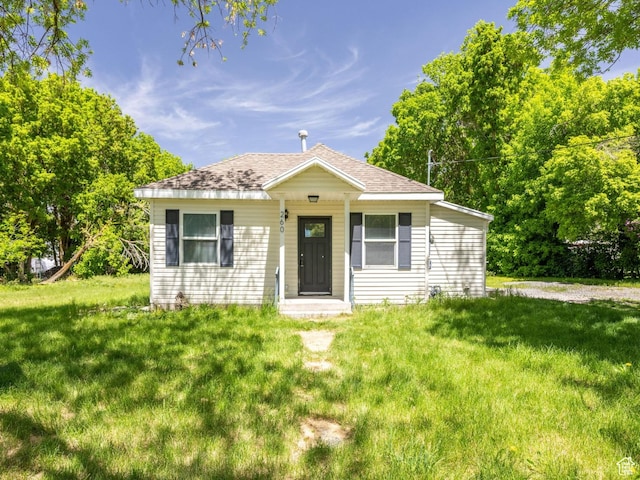 260 W 300 S, Hyrum, UT 84319 - bungalow featuring a front yard and a shingled roof