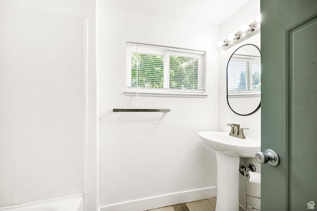 260 W 300 S, Hyrum, UT 84319 - full bathroom featuring healthy amount of natural light, baseboards, and a sink