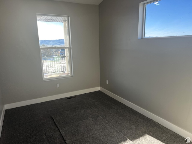 572 S 600 E Unit 2, Nephi, UT 84648 - spare room featuring visible vents, dark carpet, and baseboards