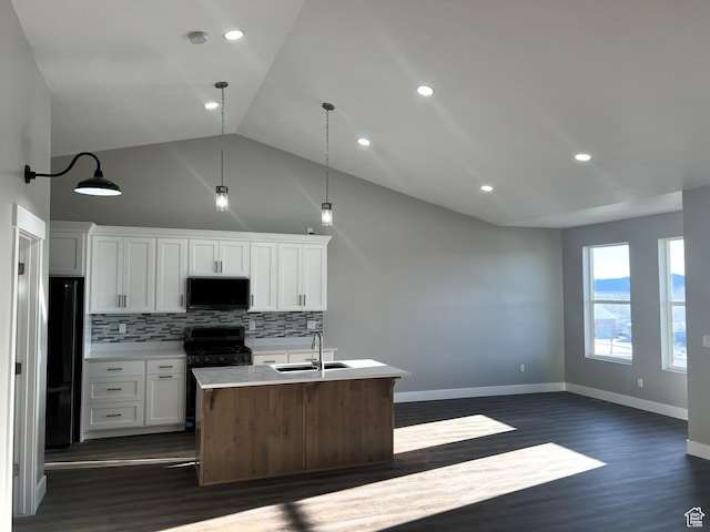 572 S 600 E Unit 2, Nephi, UT 84648 - kitchen with a sink, decorative backsplash, black appliances, white cabinets, and light countertops