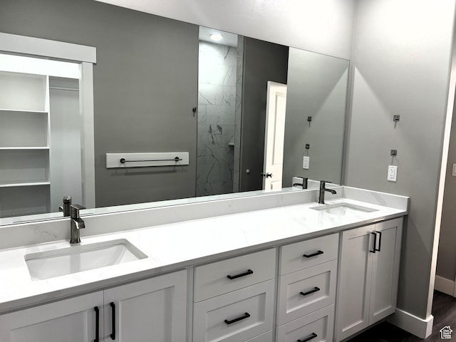 572 S 600 E Unit 2, Nephi, UT 84648 - full bathroom featuring a marble finish shower, double vanity, baseboards, and a sink