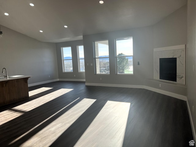 572 S 600 E Unit 2, Nephi, UT 84648 - living room featuring dark wood-style floors, recessed lighting, a healthy amount of sunlight, and baseboards
