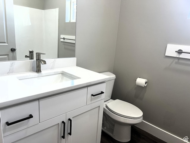 572 S 600 E Unit 2, Nephi, UT 84648 - bathroom with vanity, toilet, wood finished floors, and baseboards