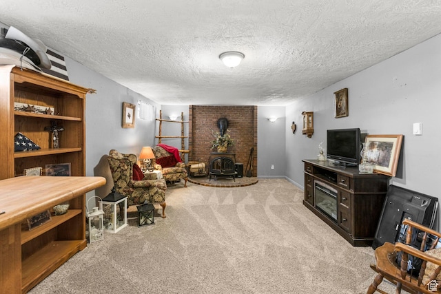 living area featuring carpet, a wood stove, and a textured ceiling