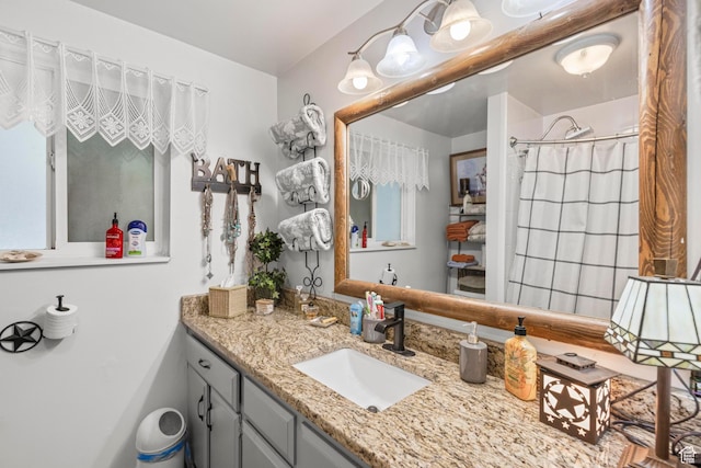 bathroom with vanity and a shower with curtain