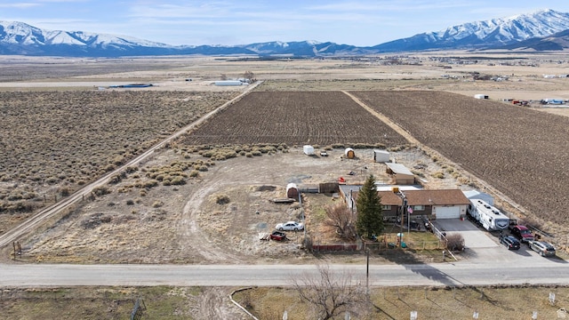 drone / aerial view featuring a rural view and a mountain view