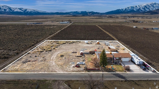 drone / aerial view with a rural view and a mountain view