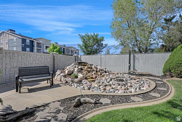 1778 Allison Way, Syracuse, UT 84075 - view of yard featuring a fenced backyard, a patio area, and a residential view
