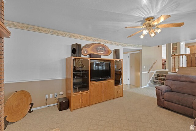 1778 Allison Way, Syracuse, UT 84075 - living room featuring baseboards, ceiling fan, stairs, and light colored carpet