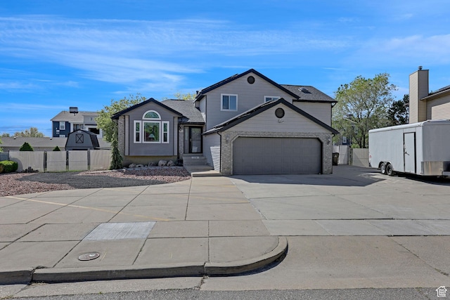 1778 Allison Way, Syracuse, UT 84075 - traditional-style home with concrete driveway, fence, and a garage