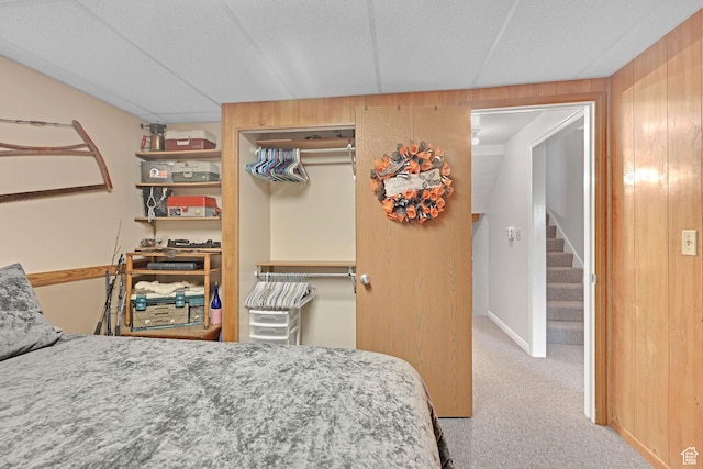 1778 Allison Way, Syracuse, UT 84075 - bedroom featuring a closet, carpet, and wooden walls