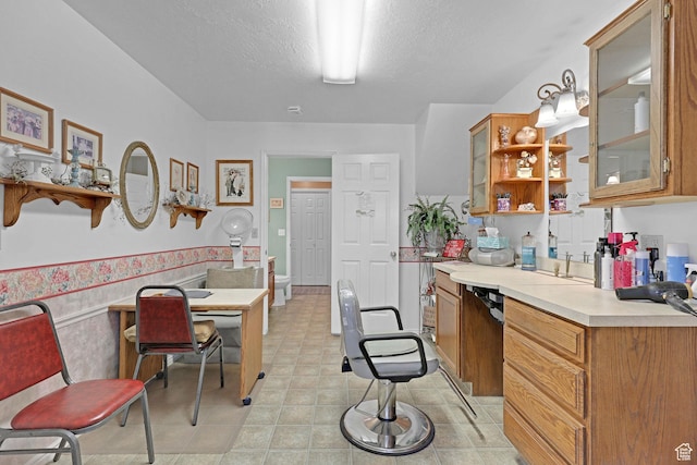 1778 Allison Way, Syracuse, UT 84075 - kitchen featuring open shelves, glass insert cabinets, brown cabinets, and light countertops