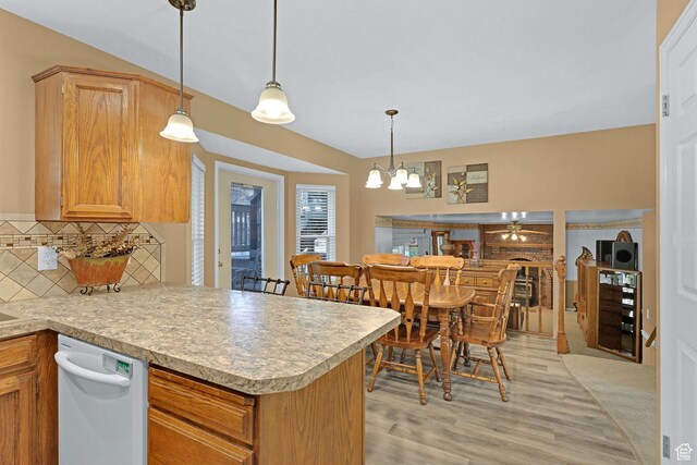 1778 Allison Way, Syracuse, UT 84075 - kitchen featuring backsplash, light countertops, light wood-type flooring, and dishwasher
