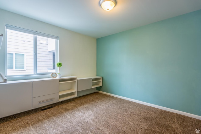 720 E 5th Ave N Unit 9, Salt Lake City, UT 84103 - unfurnished room with dark carpet and baseboards