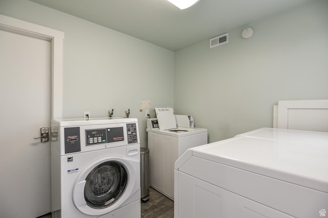 720 E 5th Ave N Unit 9, Salt Lake City, UT 84103 - shared laundry area featuring visible vents, wood finished floors, and washing machine and clothes dryer