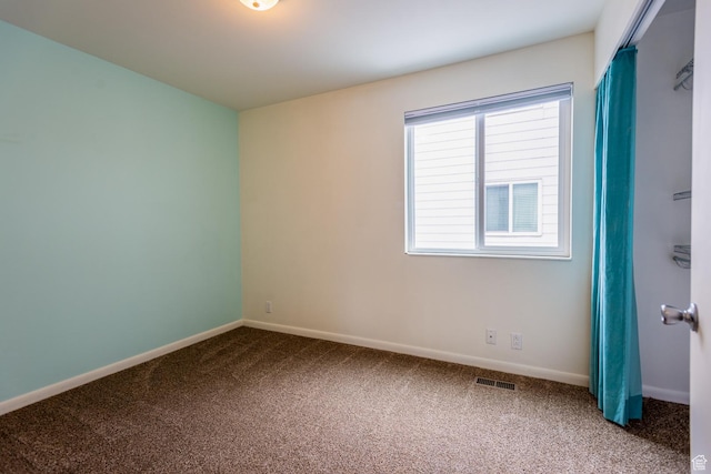 720 E 5th Ave N Unit 9, Salt Lake City, UT 84103 - unfurnished room featuring visible vents, carpet floors, and baseboards
