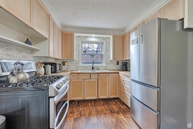 3614 Taylor Ave, Ogden, UT 84403 - kitchen featuring stainless steel appliances, light brown cabinets, a sink, light countertops, and crown molding