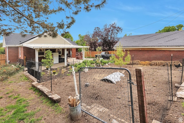 3614 Taylor Ave, Ogden, UT 84403 - view of side of property with a fenced backyard, a gate, brick siding, and a patio area