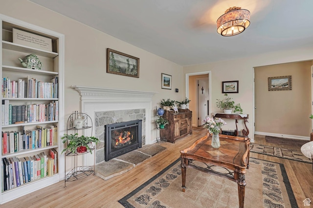 3614 Taylor Ave, Ogden, UT 84403 - living room with wood finished floors and a stone fireplace