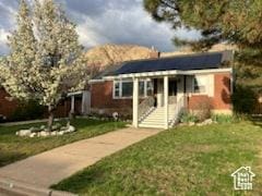 3614 Taylor Ave, Ogden, UT 84403 - view of front of house featuring solar panels and a front yard