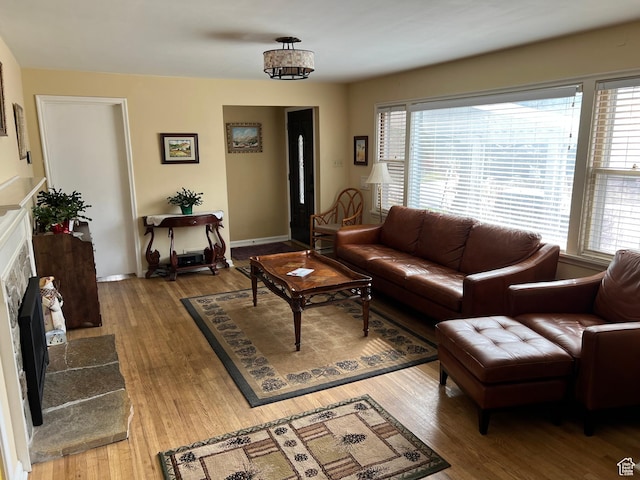 3614 Taylor Ave, Ogden, UT 84403 - living area featuring a tiled fireplace and wood finished floors