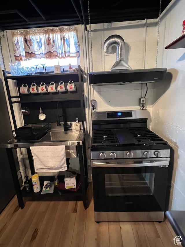 3614 Taylor Ave, Ogden, UT 84403 - interior details featuring wood finished floors and stainless steel gas range oven