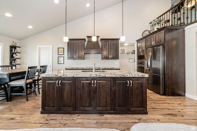 2252 W 3250 S, West Haven, UT 84401 - kitchen with stainless steel appliances, custom exhaust hood, dark brown cabinetry, light wood-style floors, and high vaulted ceiling