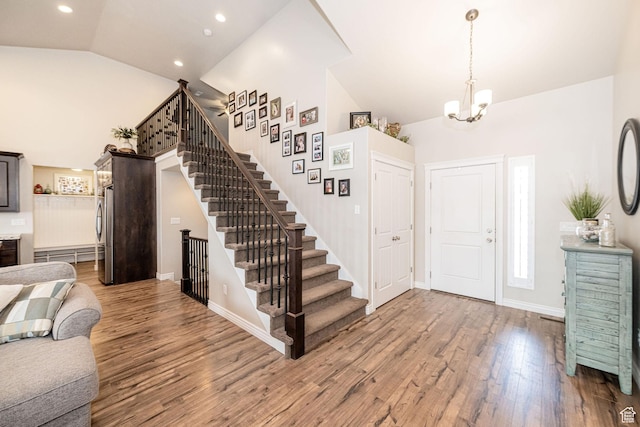 2252 W 3250 S, West Haven, UT 84401 - entrance foyer featuring recessed lighting, stairway, an inviting chandelier, wood finished floors, and high vaulted ceiling