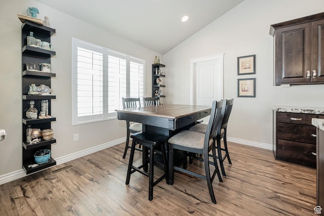 2252 W 3250 S, West Haven, UT 84401 - dining area with vaulted ceiling, visible vents, baseboards, recessed lighting, and wood finished floors