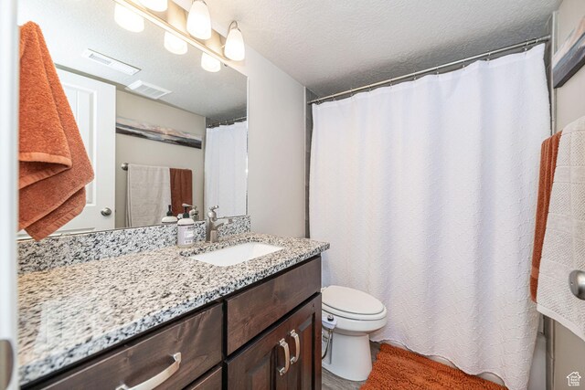 2252 W 3250 S, West Haven, UT 84401 - bathroom featuring toilet, vanity, a shower with shower curtain, and visible vents