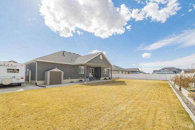2252 W 3250 S, West Haven, UT 84401 - back of house with a patio area, a lawn, a shingled roof, and fence