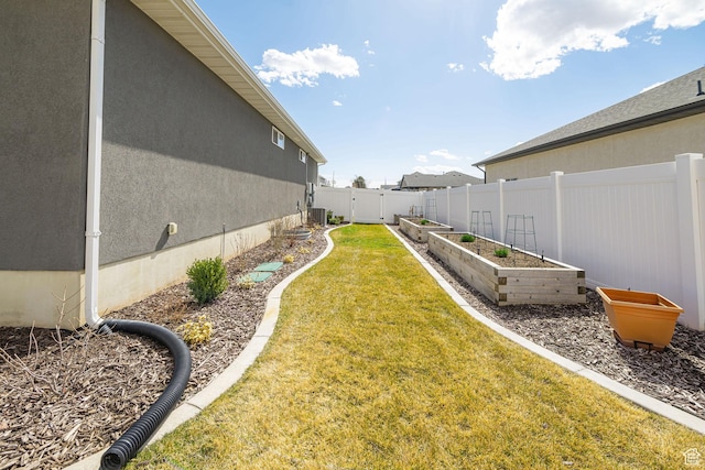 2252 W 3250 S, West Haven, UT 84401 - view of yard with a fenced backyard, a garden, and central air condition unit