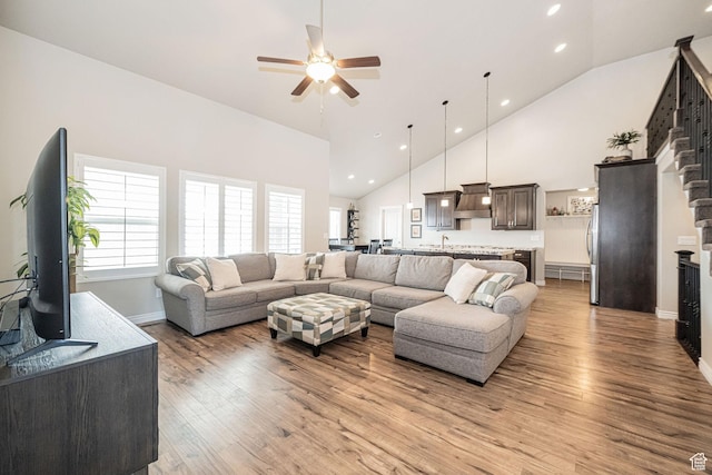 2252 W 3250 S, West Haven, UT 84401 - living area featuring baseboards, recessed lighting, light wood-style floors, a ceiling fan, and high vaulted ceiling