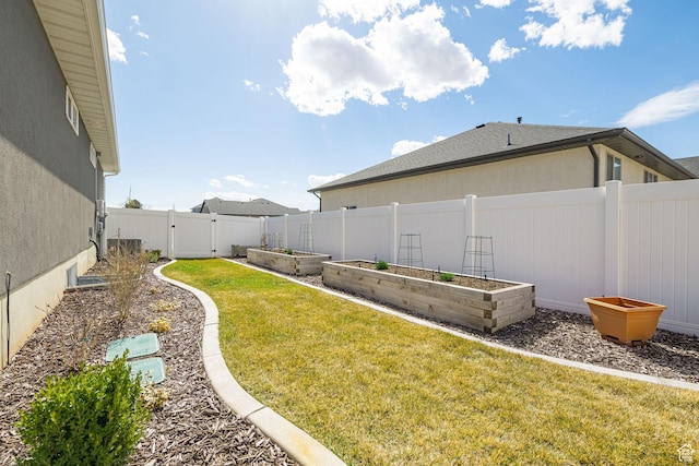 2252 W 3250 S, West Haven, UT 84401 - view of yard featuring a gate, a garden, and a fenced backyard