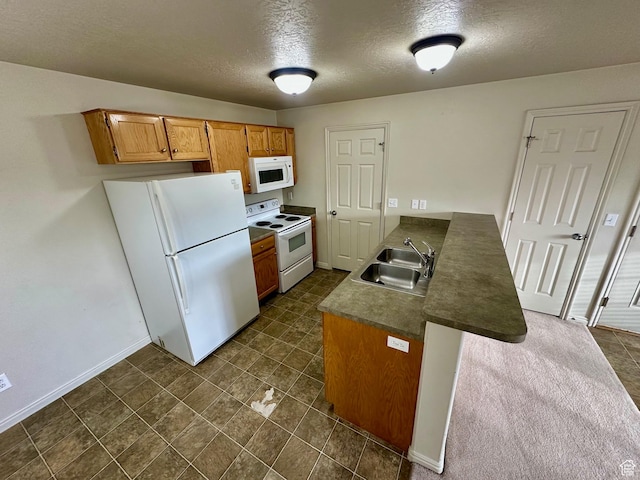 1219 S 1850 W Unit 223, Springville, UT 84663 - kitchen featuring a sink, baseboards, white appliances, and a peninsula