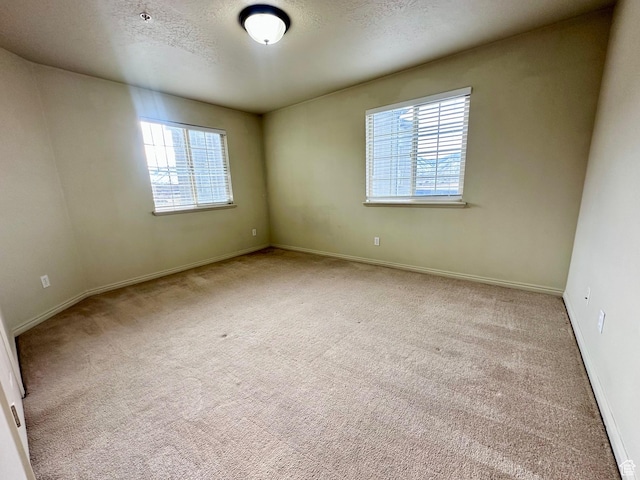 1219 S 1850 W Unit 223, Springville, UT 84663 - empty room with carpet flooring, a textured ceiling, and baseboards