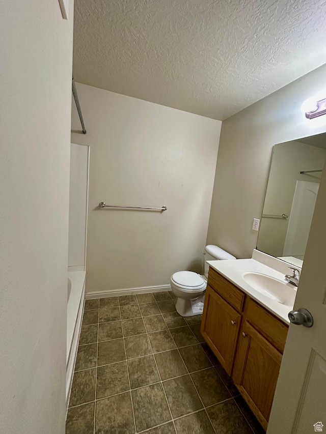1219 S 1850 W Unit 223, Springville, UT 84663 - bathroom with toilet, a textured ceiling, tile patterned flooring, baseboards, and vanity