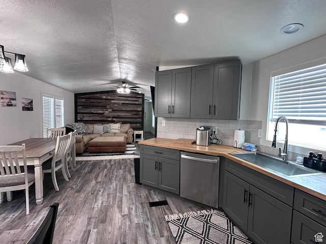 631 S Maple Dr, Garden City, UT 84028 - kitchen featuring butcher block countertops, a sink, vaulted ceiling, gray cabinetry, and dishwasher