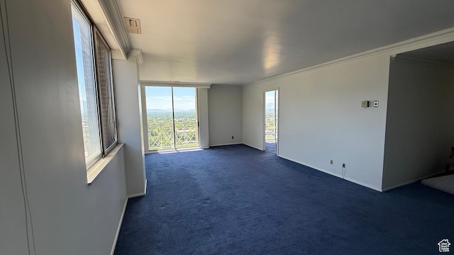 777 E S Temple Unit 13A, Salt Lake City, UT 84102 - empty room with baseboards, dark colored carpet, and crown molding