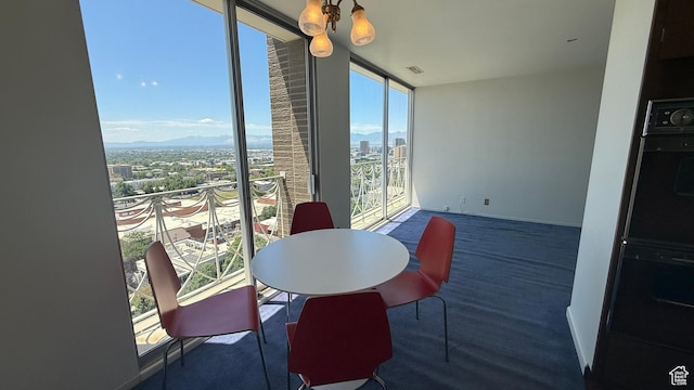 777 E S Temple Unit 13A, Salt Lake City, UT 84102 - dining room with a view of city, floor to ceiling windows, and baseboards