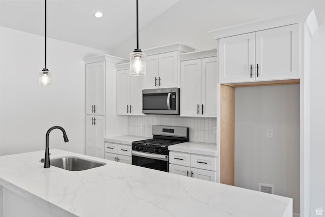 5336 S Murray Rd Unit 115, Murray, UT 84123 - kitchen featuring a sink, backsplash, white cabinetry, and stainless steel appliances