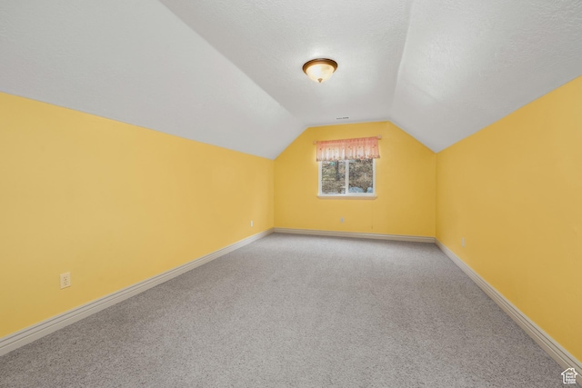 10358 N Tamarack Way E, Cedar Hills, UT 84062 - additional living space with light colored carpet and vaulted ceiling