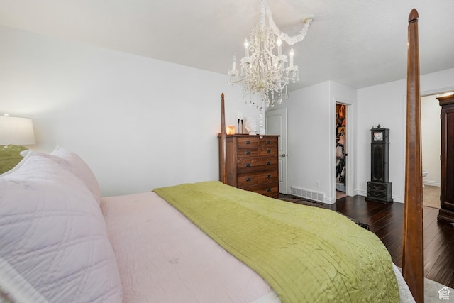 10358 N Tamarack Way E, Cedar Hills, UT 84062 - bedroom featuring hardwood / wood-style floors, a spacious closet, a chandelier, and a closet
