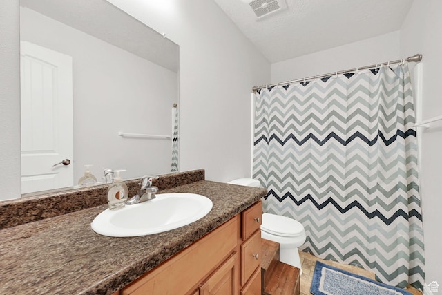 462 W 1490 N Unit 102, Logan, UT 84341 - full bathroom with toilet, vanity, wood finished floors, and a shower with shower curtain