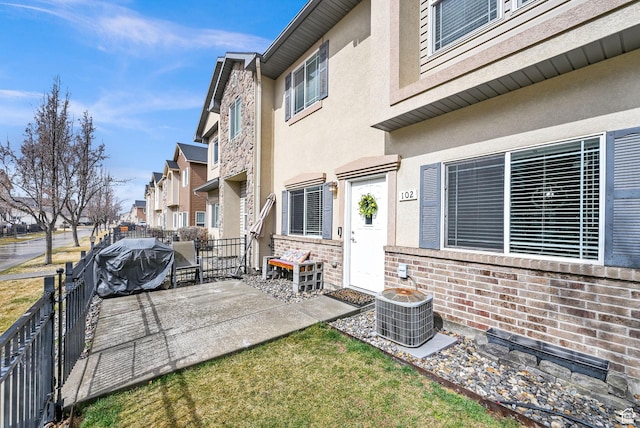 462 W 1490 N Unit 102, Logan, UT 84341 - view of patio / terrace with fence, cooling unit, and a residential view