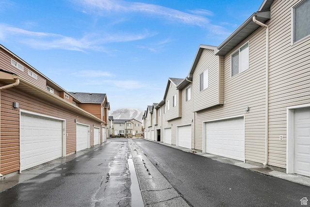 462 W 1490 N Unit 102, Logan, UT 84341 - view of asphalt alley with community garages and a residential view