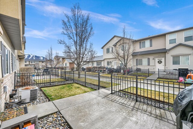 462 W 1490 N Unit 102, Logan, UT 84341 - view of patio / terrace featuring a residential view and central AC unit